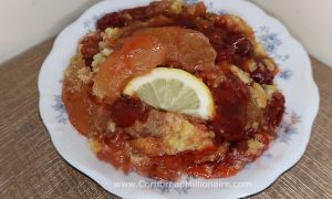 Apple Cherry Lemon Dump Cake with a lemon slice.