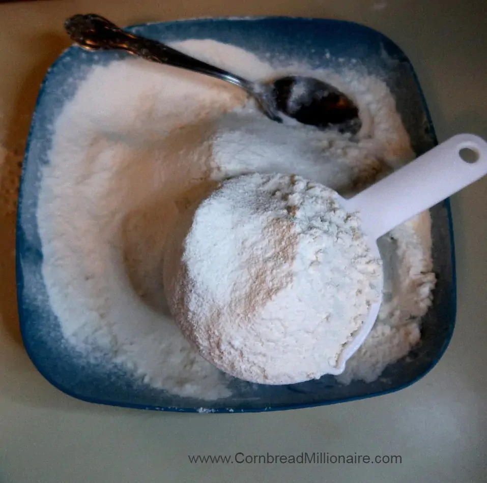 Use a spoon to lightly scoop sifted flour and place in measuring cup. 