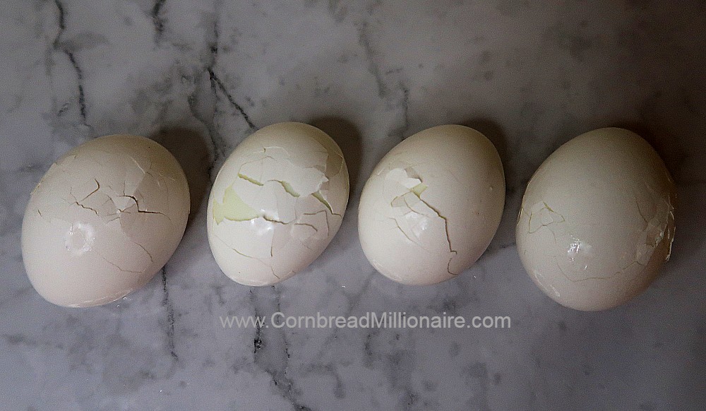 Lightly tap each chilled egg on a flat surface to avoid dents.