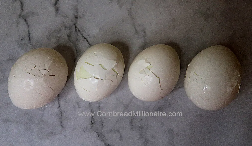 Lightly tap each chilled egg on a flat surface to avoid dents.