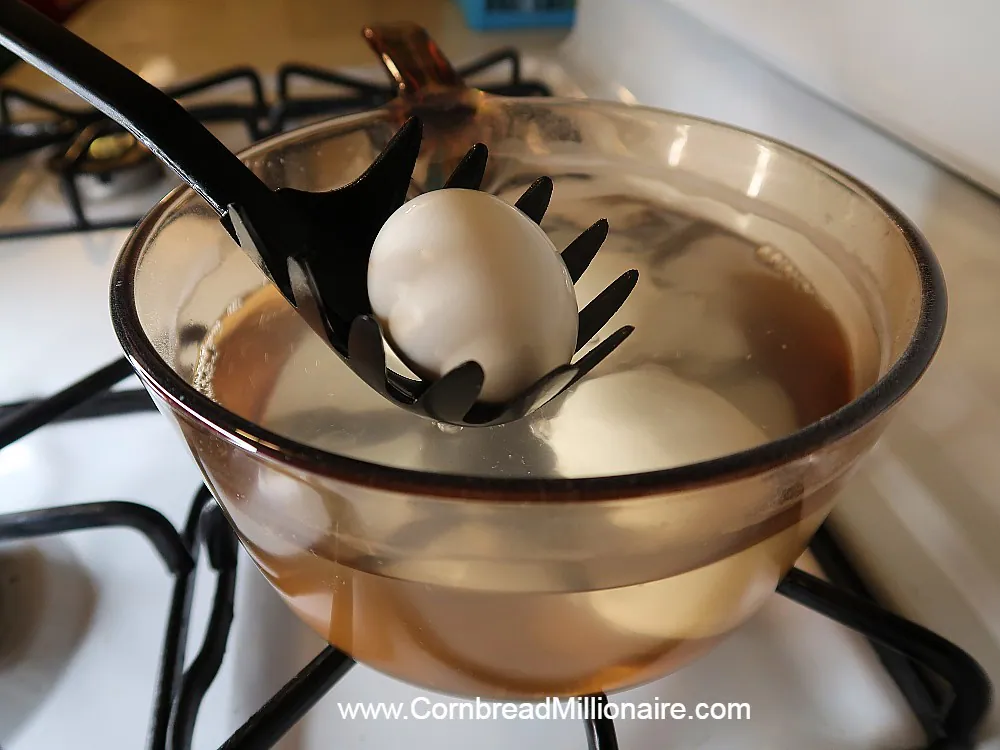 Immediately after turning off heat, use a slotted spoon to quickly remove hard boiled eggs from hot water. 